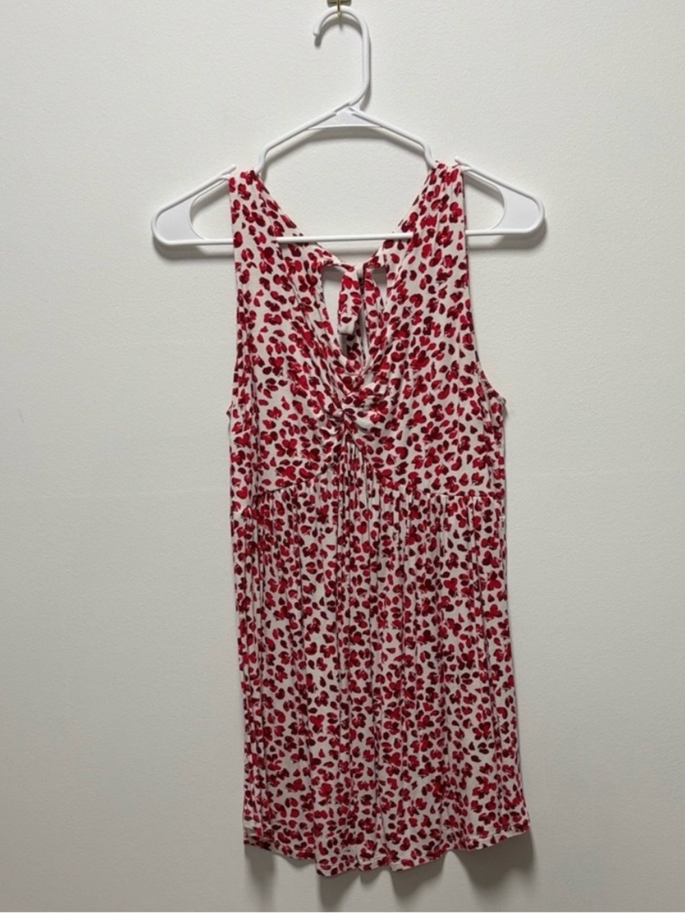 Sleeveless White Shirt with Red Floral Print